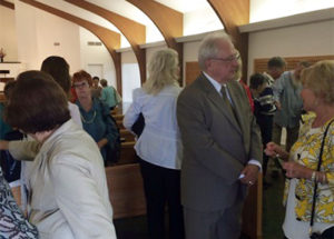 Allen greeting congregants.